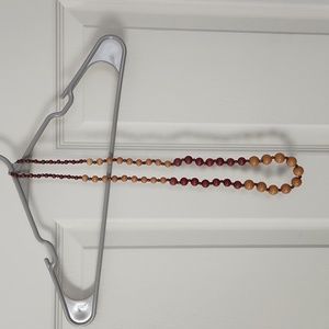 Maroon, mustard, and, green beaded necklace.